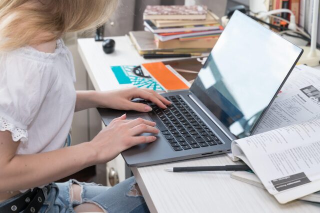 girl-doing-homework-at-the-laptop-WWXZHMY-min-scaled