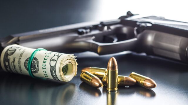 9-mm-bullets-dollars-and-handgun-PVMJ5TH-e1526372084299