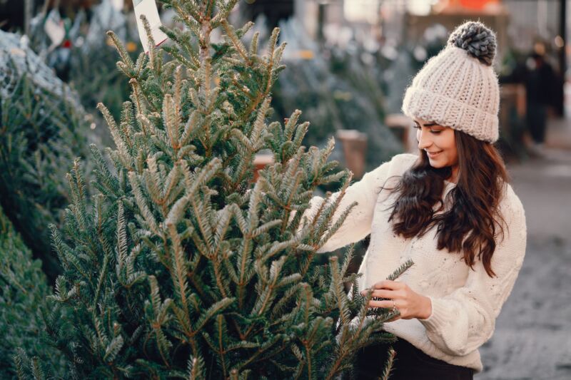 cute-brunette-white-sweater-with-christmas-tree